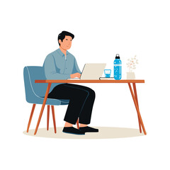 Young Man Sitting at Desk Using Laptop