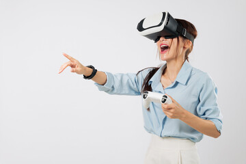 VR game excitement with Young Asian woman pointing during VR game play, immersed in joyful virtual reality experience. isolated studio white background
