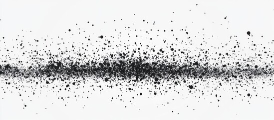 Abstract black speckles scattered across a white background (1)