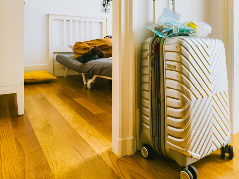 Packed Luggage and Sleeping Teen
