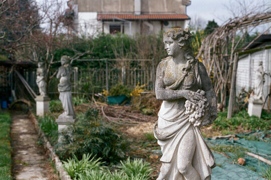 Naklejki Ornamental statues in garden on film