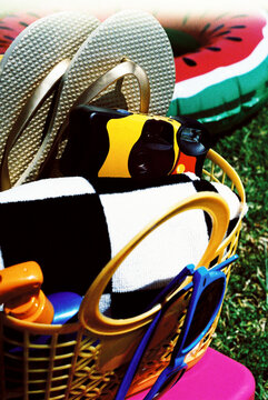 basket with a disposable camera and summer items, 35mm
