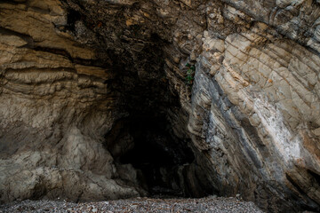 Sea-eroded caves in the coastal cliffs.