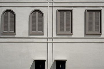 a beautiful, interesting, minimal backdrop with bright white architectural details and a few...