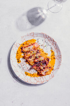 Octopus with creamy mashed potatoes, paprika oil and black salt