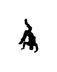 Silhouette of a person performing a breakdance move, balancing on hands and head with legs extended.