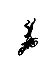 Silhouette of a motocross rider mid-air, upside down after a jump.