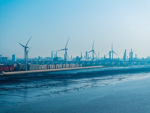Aerial View of Coastal Industrial Park with Wind Power and Factory Bui
