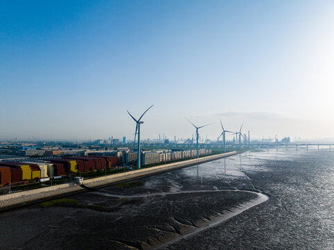 Aerial View of Coastal Industrial Park with Wind Power and Factory Bui