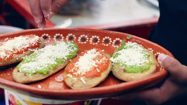 Mexican food, dish with garnachas with green and red sauce and cheese, tlacoyos, huaraches.