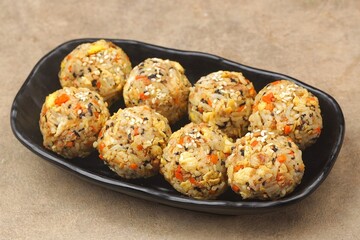 Korean rice balls or Jumeokbap (주먹밥) are a quick and easy snack or lunch made with leftover rice and various fillings that are shaped into a ball