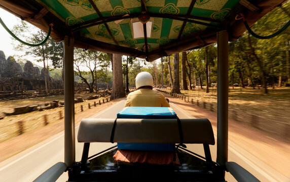 Riding in a Tuk-Tuk Through Forested Temple Road