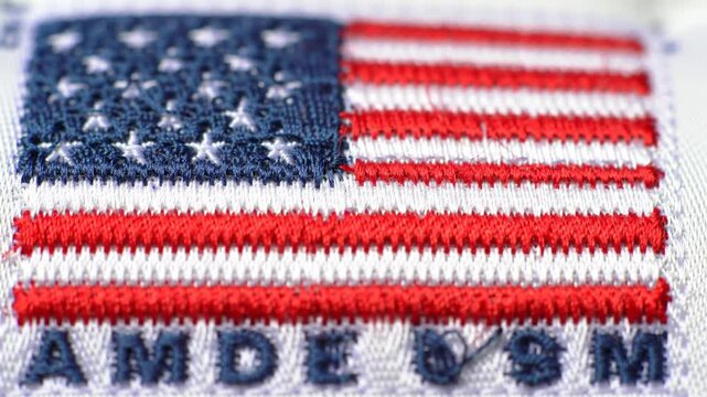 Detailed close-up of American flag patches featuring embroidered stars and stripes design