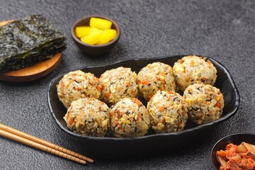Korean rice balls or Jumeokbap (주먹밥) are a quick and easy snack or lunch made with leftover rice and various fillings that are shaped into a ball