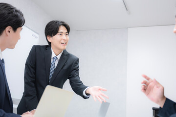 Multiple images of young salespeople at their desks explaining to customers presentations,...