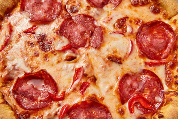 Close up of full pepperoni pizza with melted cheese closeup