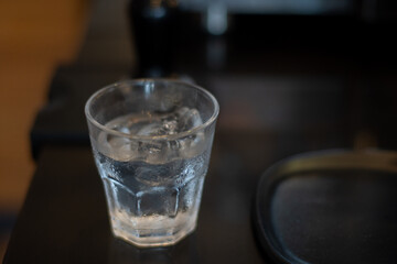 A glass of water with ice cubes