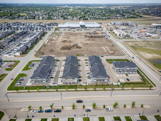 View of a residential area with a large number of houses and a shopping center