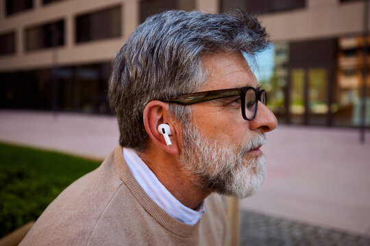 Profile of a man wears earbuds