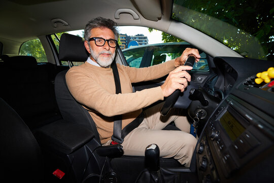 Man is parks his car