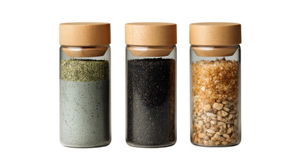 Three glass spice jars with wooden lids, filled with various colorful spices and seasonings, on a white background.