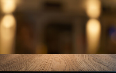 Empty wood table top and blur of restaurant background selective focus product display
