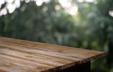 Empty wood table top and blur of restaurant background selective focus product display
