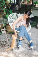 Smiling Beautiful asian young woman with Egyptian Sphynx cat Canadian Sphinx breed cat