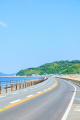 初夏の志賀島へと続く一本道　福岡県福岡市　A road leading to Shikanoshima in...