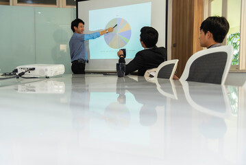 Motivated professional team members gathered together at corporate seminar raise hand, agree with...