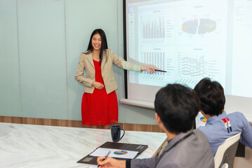 Motivated professional team members gathered together at corporate seminar raise hand, agree with...