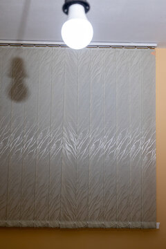 A light bulb hangs from the ceiling.