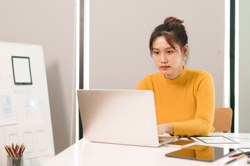Young Asian UI UX Designer Working on Laptop Creating Mobile App Interface Web Design User...