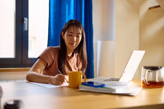 Woman works on her freelance project