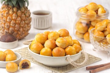 Nastar is a dry cake made from a mixture of wheat flour, butter and eggs filled with pineapple jam