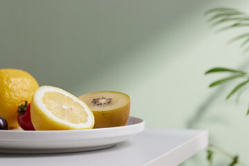 A cozy backdrop with fresh fruits and grass on a table with natural sunlight and shadows.