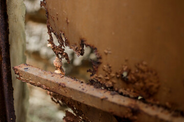 Close Up Of Severely Rusted Brown Metal Surface With Large Irregular Hole