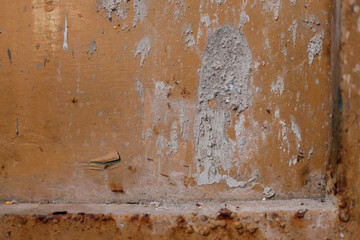 Close Up Of Damaged Rusty Metal Surface With Large Patch Of Cement