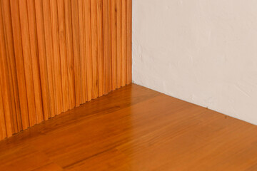 Brown Wood Panels Meet Textured White Wall And Reflective Light Colored Floor