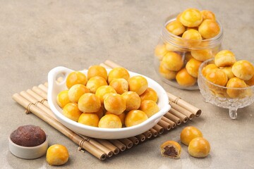 Nastar is a dry cake made from a mixture of wheat flour, butter and eggs filled with pineapple jam