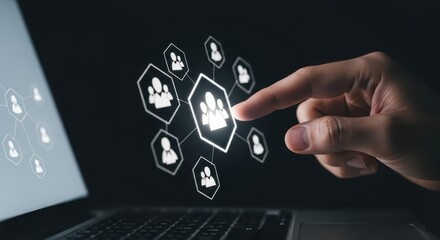 Innovative Collaboration Hand Interacting with a Digital Team Icon on a Laptop Screen