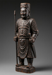 Fototapeta premium Dark wooden carved warrior figurine