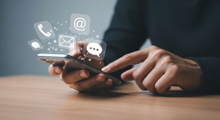 Close-up of hands using a smartphone with digital communication icons overlayed, suggesting digital interaction and communication.