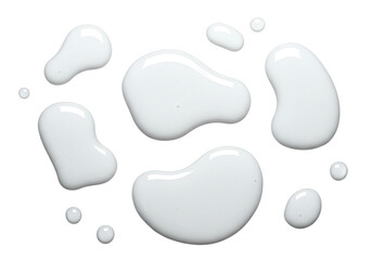 Several irregular blobs of white liquid, isolated on transparent background, create a clean and abstract design