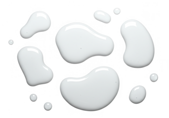 Several irregular blobs of white liquid, isolated on transparent background, create a clean and abstract design