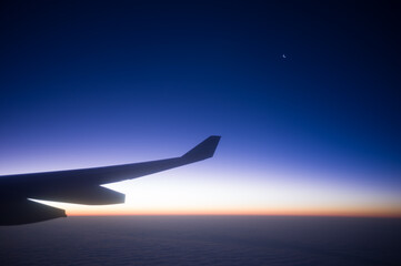 Moonrise at 35,000 Feet – A Journey Through Twilight