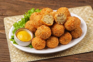 Bitterballen is the name of a type of food in the Netherlands. Bitterballen taste similar to...