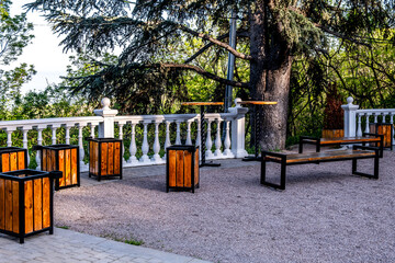 Trash cans and benches on the recreation area.