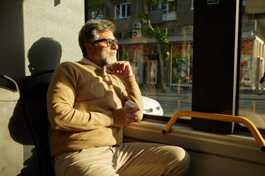 Man looking out the bus window