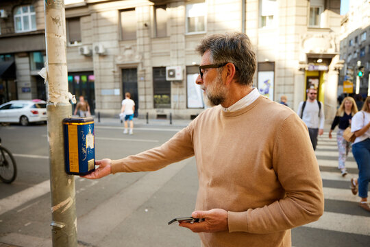 Man uses the traffic light button